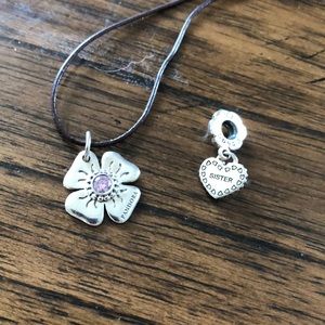 Pandora “Sister” charm and flower charm bracelet.
